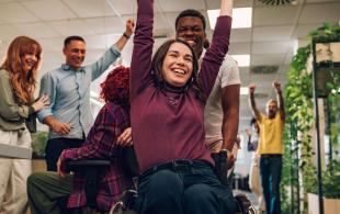 woman-who-uses-wheelchair-celebrating-winning