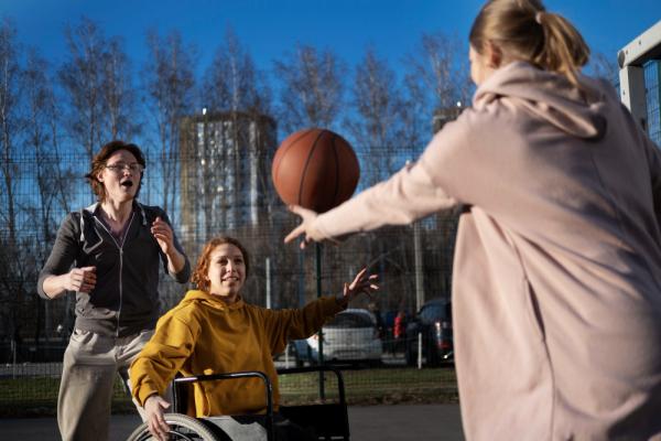 Woman wheelchair playing basketball
